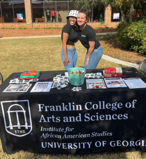 Layla Greenwood and Chera Jo Watts promote AFAM courses and programs outside of the UGA Bookstore