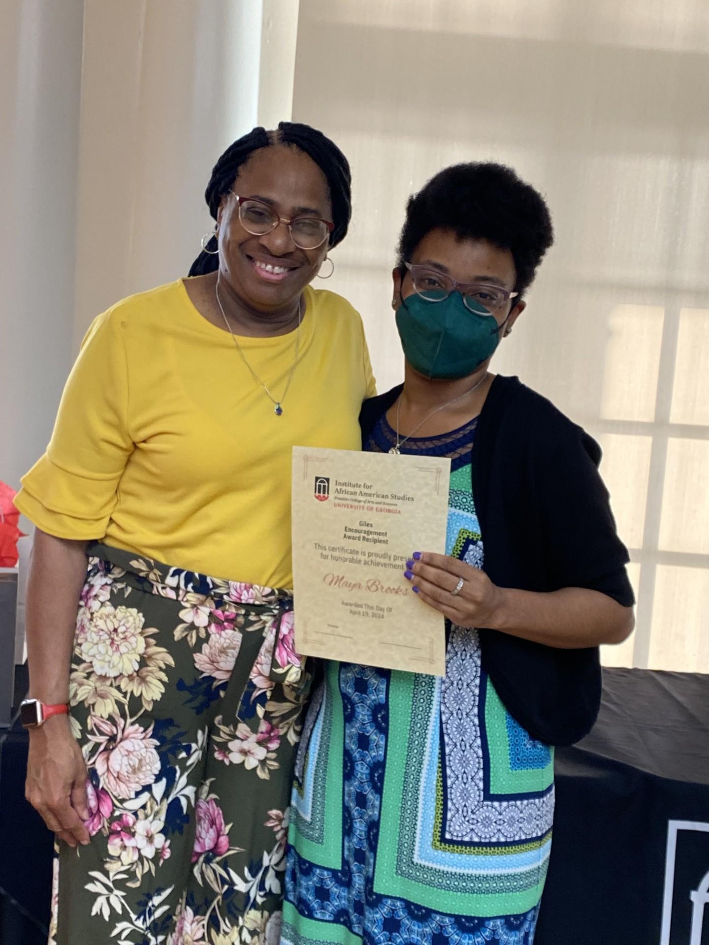 Graduate award winner Maya Brooks and her mother